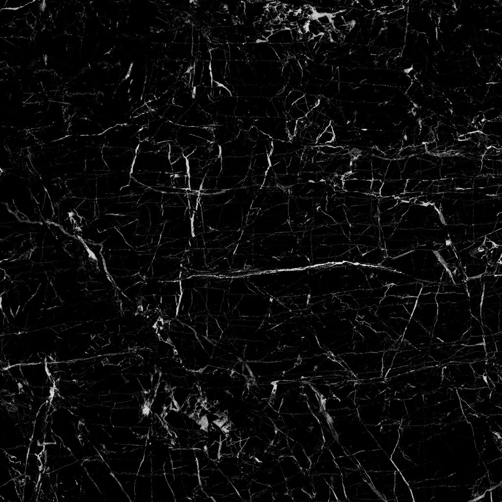 Neolith Niagara, piedra sinterizada de fondo negro intenso con vetas blancas, ideal para mesadas y revestimientos.